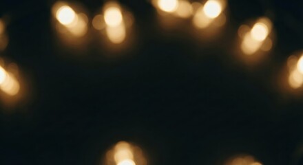 Warm golden bokeh lights framing a dark center, creating a festive and glowing background