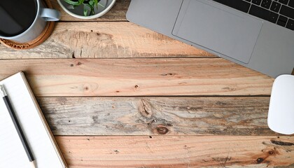 Minimal workspace flat lay with laptop, notebook and coffee on wooden desk