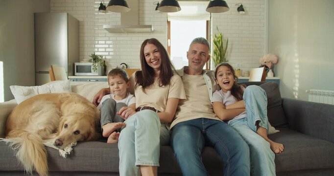 Relaxed household with children and pet in comfortable setting