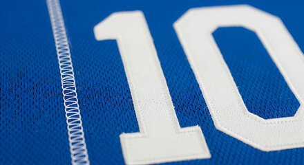 Close up of white number ten on blue jersey