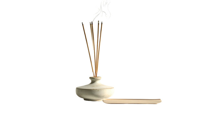 White ceramic diffuser vase holds reeds with Asian calligraphy & small wooden tray
