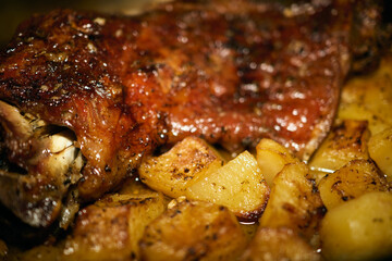 Oven-baked goat with potatoes