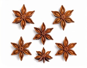 Dried star anise pods, artfully arranged on a pristine white studio background, showcasing their distinct star shape and rich brown color for culinary spice themes