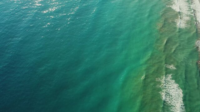 From a bird's-eye view, Patara Beach in Turkey is considered the longest sandy beach in the country. Turquoise sea from a bird's eye view. Aerial view of the pristine Patara Beach in Antalya. 4К
