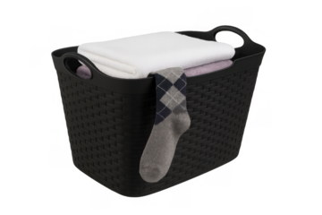 Black plastic laundry basket filled with clean folded clothes and a patterned sock hanging over the side