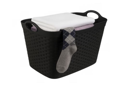 Black plastic laundry basket filled with clean folded clothes and a patterned sock hanging over the side - Powered by Adobe