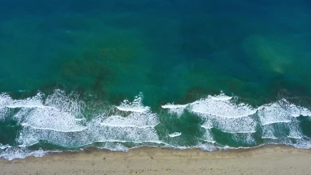 From a bird's-eye view, Patara Beach in Turkey is considered the longest sandy beach in the country. Turquoise sea from a bird's eye view. Aerial view of the pristine Patara Beach in Antalya. 4К