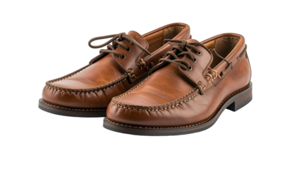 Two tan leather boat shoes with laces, stitched details, and brown soles, against a dark void