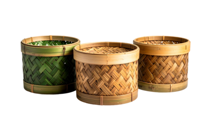 Three woven cylindrical containers. One green, two tan, with bamboo detailing. Black background