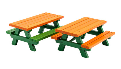 Two miniature outdoor picnic tables in orange and green, isolated on black