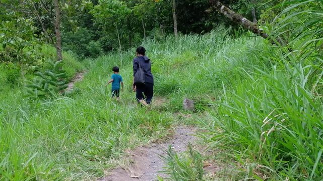 family walking in the woods, Java, Indonesia, South East Asia