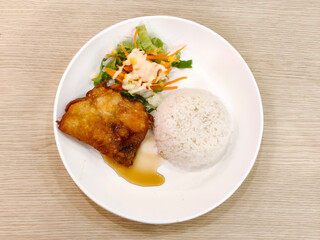 Top view of Crispy fried chicken with fish sauce on rice. Thai food