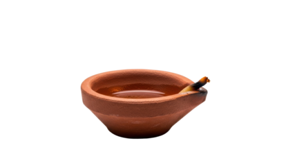 Single clay diya oil lamp filled with liquid and wick on black background terracotta, Isolated On Png Transparent Background