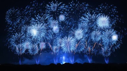 Blue fireworks exploding at the edge with white sparks, creating a vibrant, festive, and celebratory atmosphere perfect for holidays, events, and special occasions.