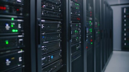 Close-up shot of server racks with blinking lights, cables, and hardware, symbolizing data centers, network infrastructure, technology, and high-performance computing. - Powered by Adobe