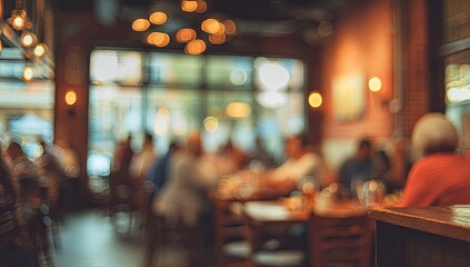 Blurred interior of a busy restaurant with patrons dining at tables