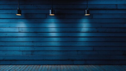 Three spotlights illuminate a textured blue wooden wall and floor