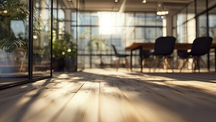 Sunlit modern office interior with glass walls, plants, and a table