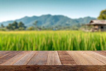 Wooden tabletop over a blurred rural landscape
