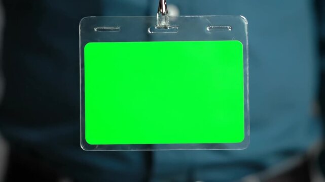 Blank green screen badge holder with a lanyard, ready for customization and identification.