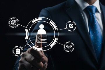 Businessman interacting with digital interface and icons on dark background