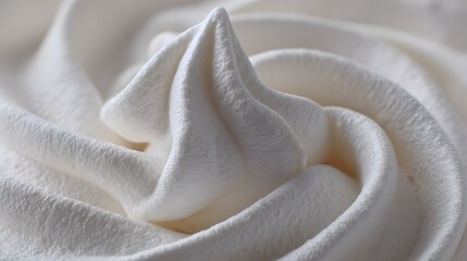 Close-up of Swirled White Frosting or Whipped Cream.