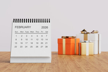 White Desk Monthly February 2026 Business Calendar Near Gift Boxes. 3d Rendering