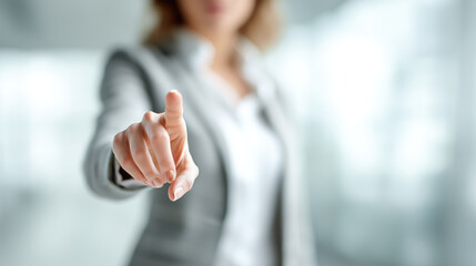 Businesswoman making selection gesture on screen