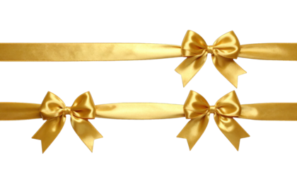 Gold satin ribbons with bows, arranged on a black background