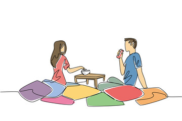 Continuous line draw of couple sitting on colorful floor cushions. Creative cozy setup, snacks, and relationship happiness while in living spaces for extra comfort and fun, National Movie Night event