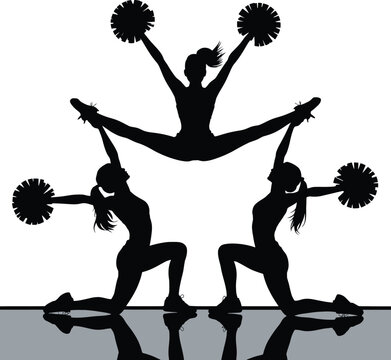 Cheerleaders in Silhouette Performing Stunts with Pom Poms