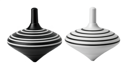 Black and white wooden spinning tops on black background