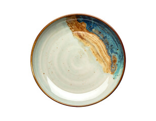 A ceramic plate showcasing a two-tone, abstract design with brown and blue glazed accents against an off-white backdrop. Rimmed in a darker tone