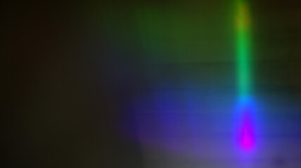 Slim neon column of green dropping into violet pool, vertical spectrum beam hovering in shadow, dreamy abstract prism light reflecting across layered waves of color

