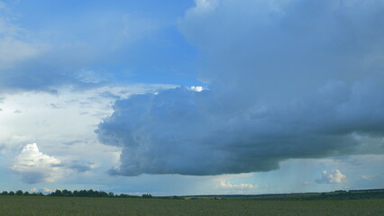 The Formation of Clouds Over Serene Fields Under Dramatic and Striking Skies Surroundings