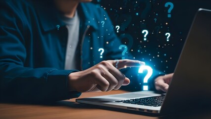 Man using laptop with glowing question marks symbolizing problemsolving and seeking answers in a digital world.