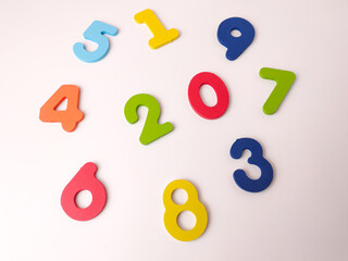 Fototapeta premium Colorful wooden or foam number manipulatives, likely part of a puzzle or learning set