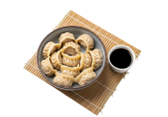 Authentic Asian Dumplings Served With Soy Sauce On a Mat