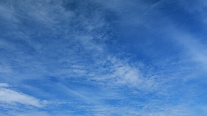 A Stunningly Beautiful and Expansive Blue Sky Adorned with Wispy and Delicate Clouds Above