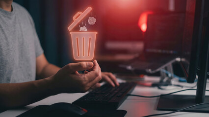 Data delete cyber security concept, digital trash icon glowing, office desk computer monitor, man hand hold hologram, modern technology