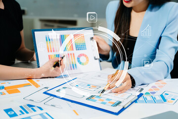 Close up view of UI developer team brainstorming on their project with laptop, smartphone and digital tablet. Creative digital development agency.