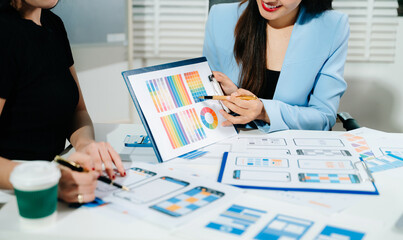 UX developer and ui designer brainstorming about mobile app interface wireframe design with customer breif and color code