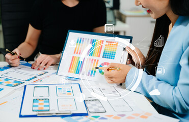 Close up view of UI developer team brainstorming on their project with laptop, smartphone and digital tablet. Creative digital development agency.