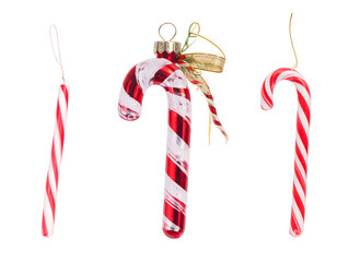 Three festive candy cane ornaments on a black background