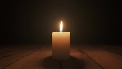 A solitary candle flame glows warmly in the darkness, casting light on a wooden surface