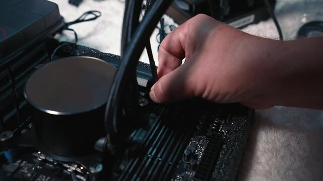 Connecting cable to header near water cooling system