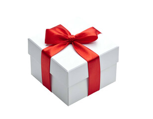 Obraz premium A white gift box with a bright red ribbon tied in a bow