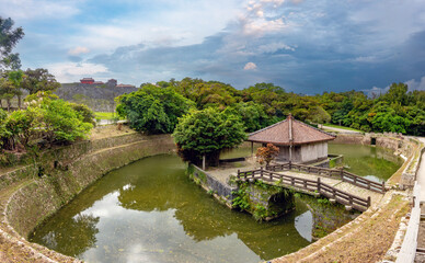 Fototapeta premium View of picturesque Enkanchi Pond and Benzaiten-do Temple right outside of the walls of the Shuri castle ruins, Naha, Okinawa, Japan