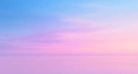 Obraz premium Soft pastel sunset with wispy clouds in serene sky