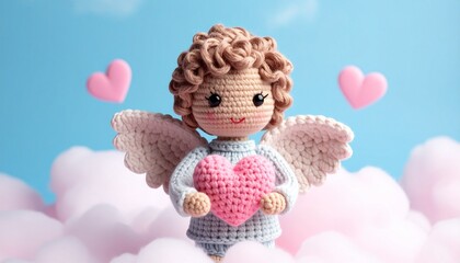 Crocheted angel doll with white wings and pink heart against cloud and blue sky background